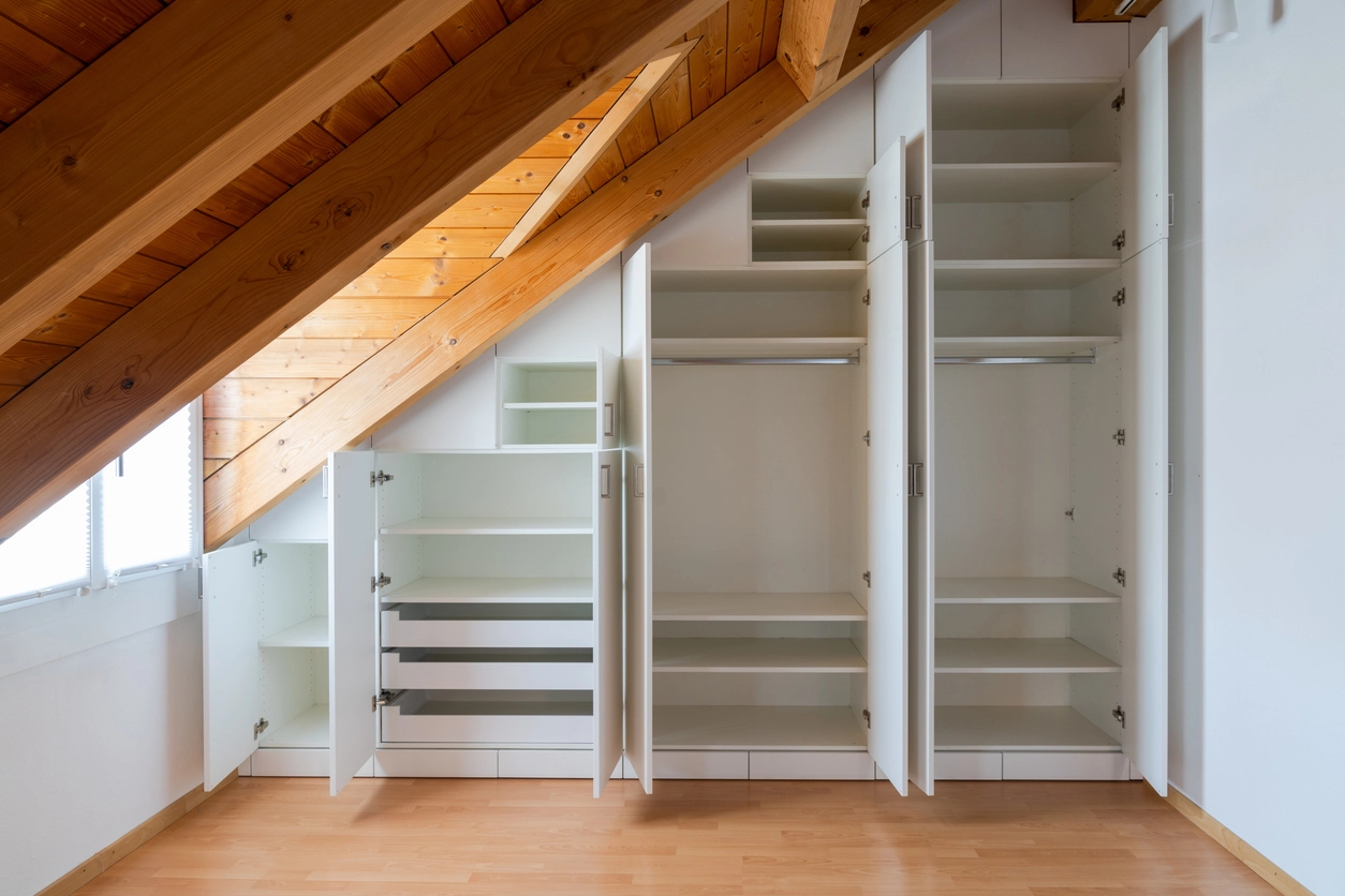 a customer carpentry build in storage unit in the attic of a home