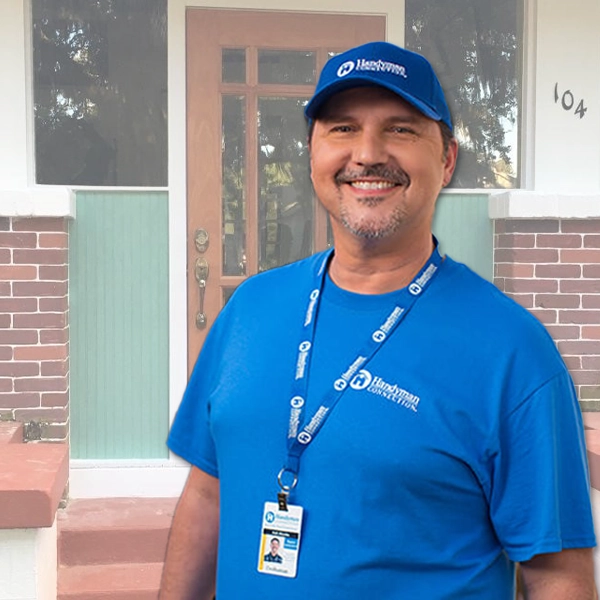 Handyman smiles in front of upgraded front doorstep