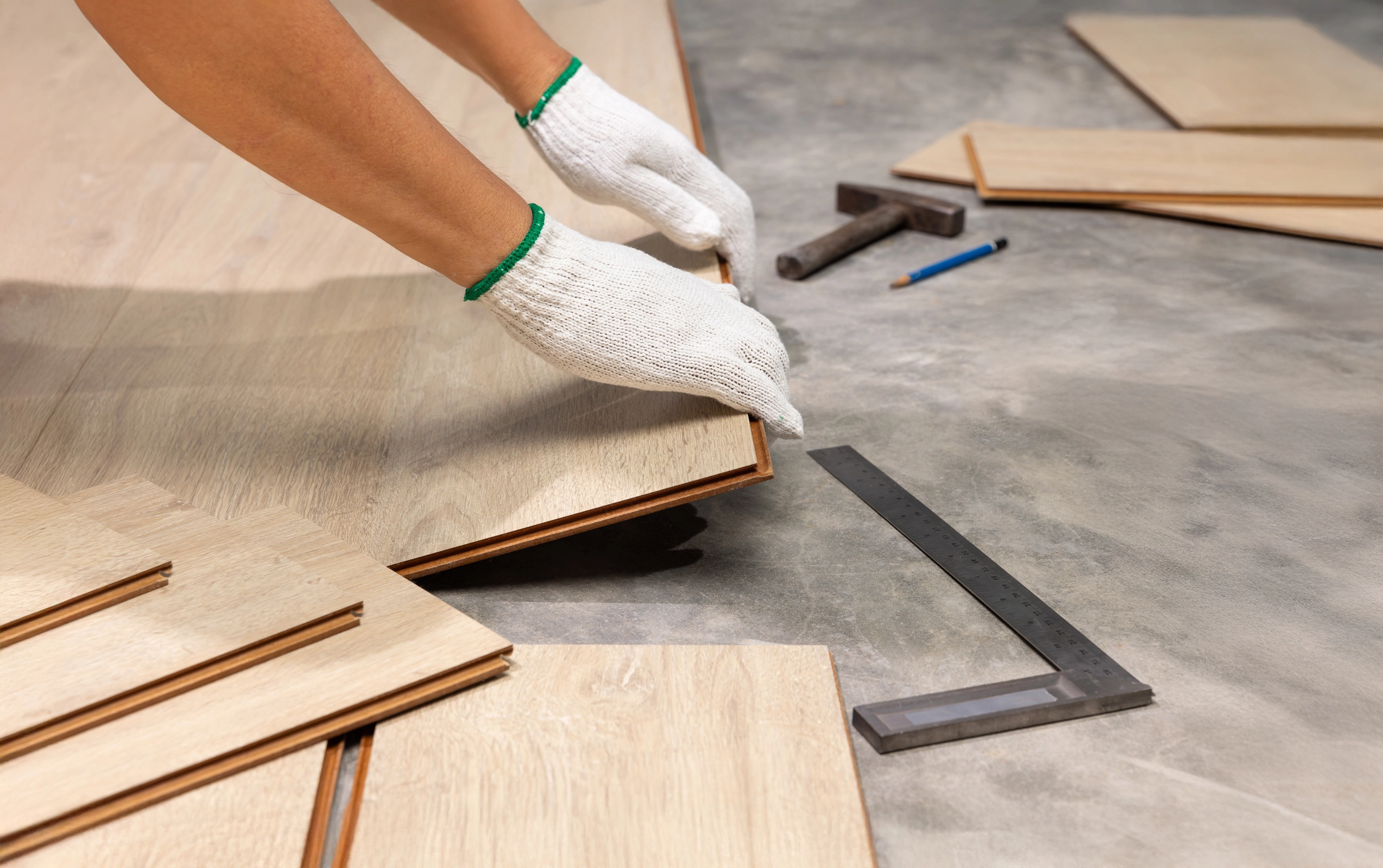 Close up of new flooring being pieced together