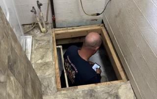 basement plumbing - worker SMALL | Handyman Connection of Lake Orion basement-plumbing-worker